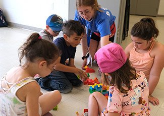 Children with councillor at summer day camp